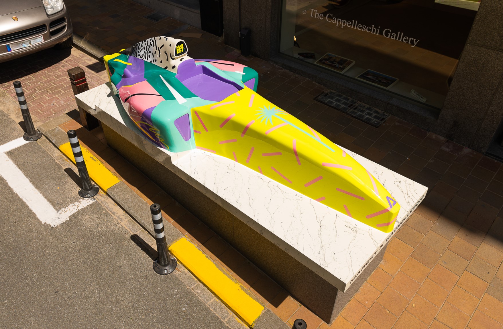 Colorful race car sculpture designed by Antonio Marest outside The Cappelleshi Gallery in Knokke