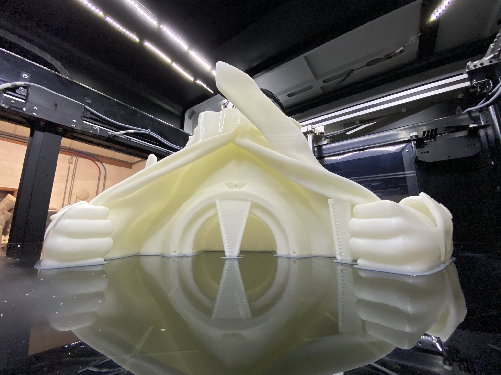 Partial 3D print in progress of a large-scale sculpture, showcasing intricate details and structure