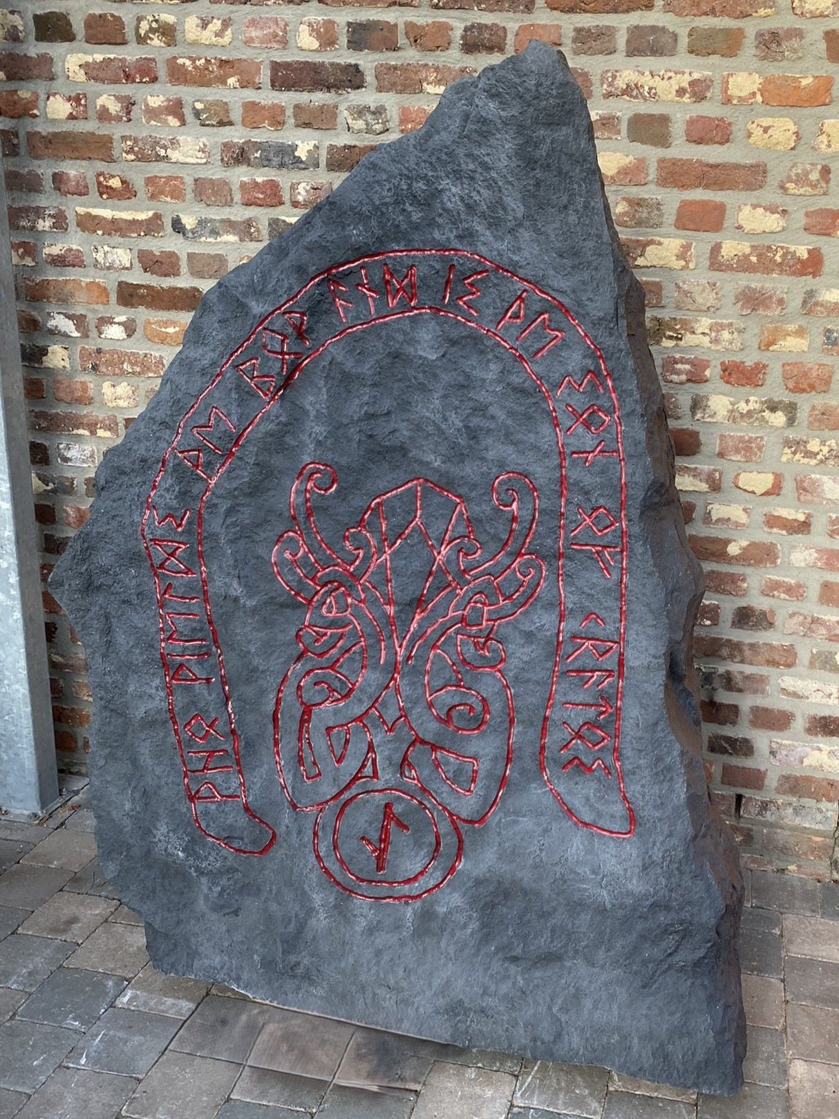 Large polyester rune stone with red carvings, created for the God of War: Ragnarök promotion by Art Nzo